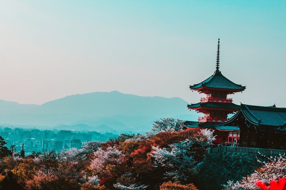 Scenic view of Kiyomizu-dera Temple with cherry blossoms in Kyoto, Japan